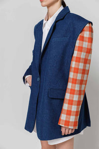 Dark blue denim jacket-constructor with orange-blue checkered crepe left sleeve left side